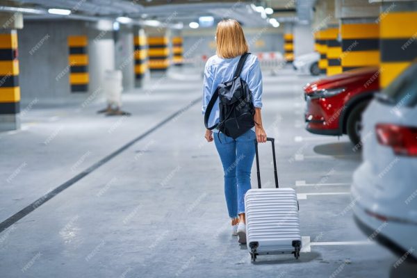 adult-woman-tourist-underground-airport-parking-lot_470178-8390